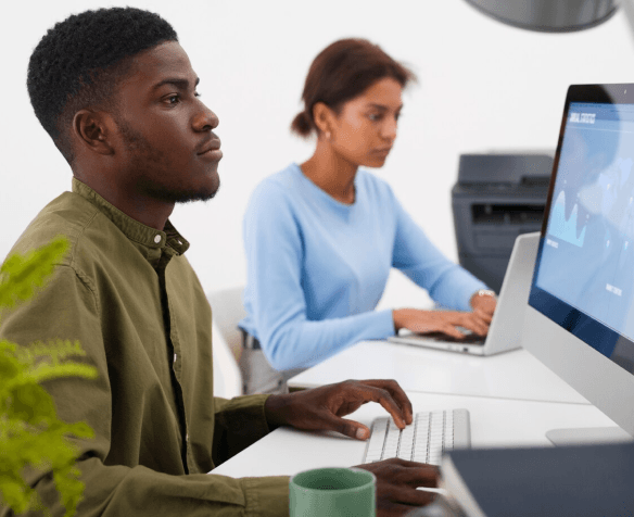 guy typing with a computer